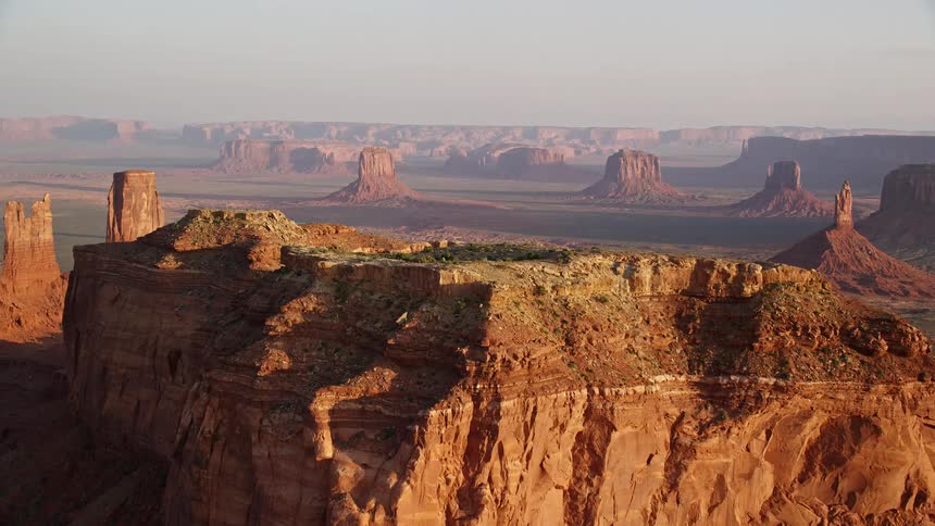 A desert region with several mesa rock formations