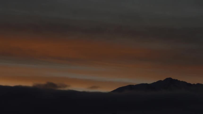 Mountain covered in fog during dawn