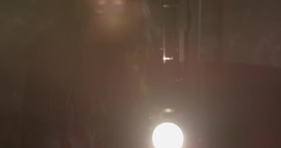 Child turns a film projector on