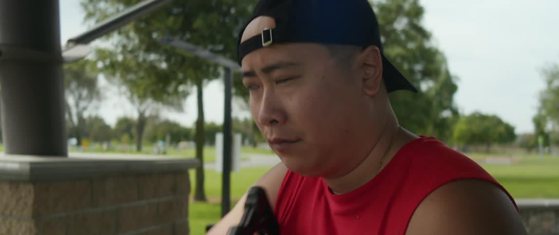 A concentrated man shooting an arrow from the crossbow