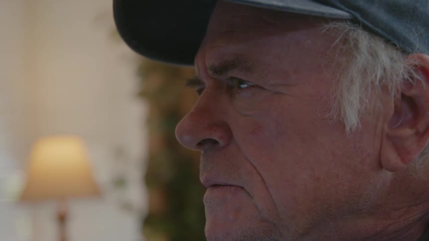 Portrait of an elderly person with a thoughtful facial expression