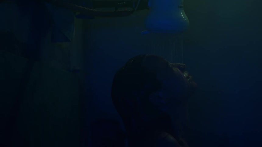 Portrait of a woman taking a bath at night
