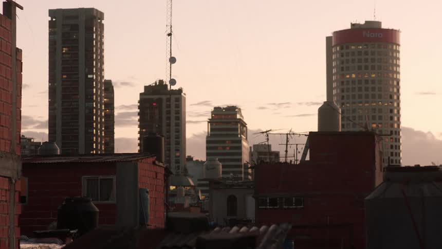 An office building next to the apartment building and houses