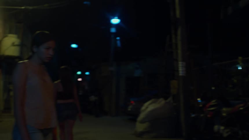 Two women were walking in a dark and dirty night