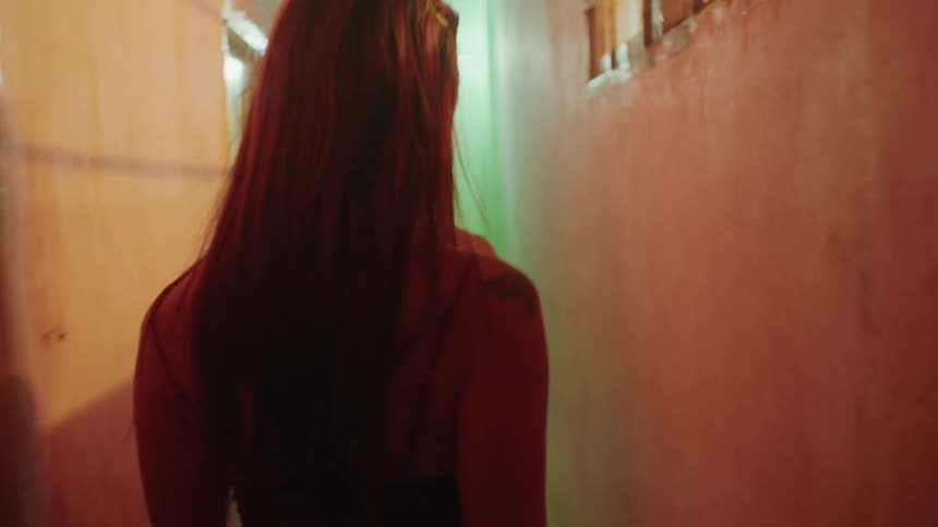 A woman waiting for her friend who is coming down the stairs then they start descending other outdoor stairs in the neighborhood