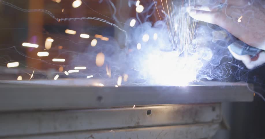 A person is welding metal