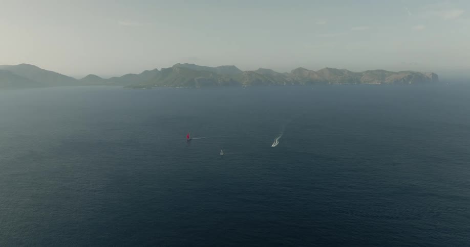 Three boats sailing in the calm waters