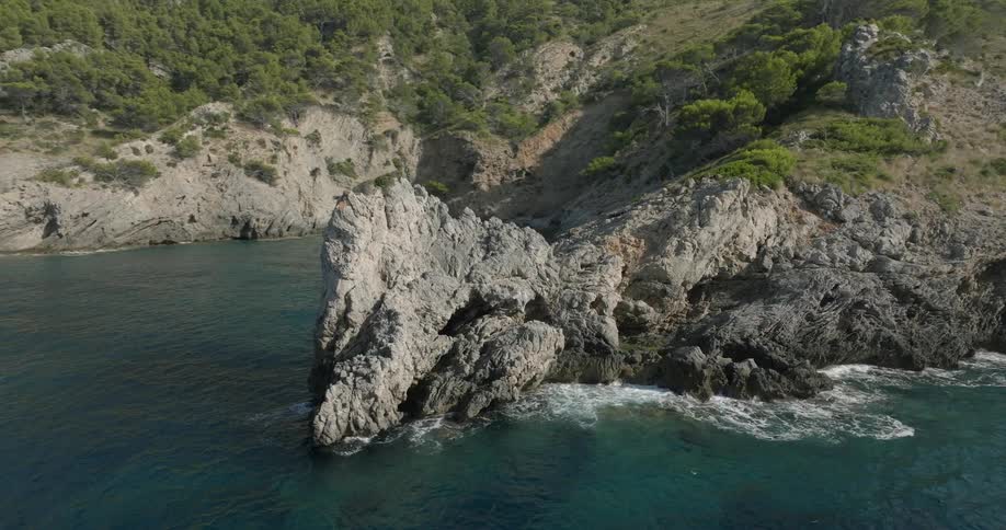 Aerial of a desert island with mountains and forests