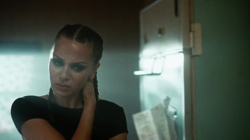 A woman screams in her kitchen