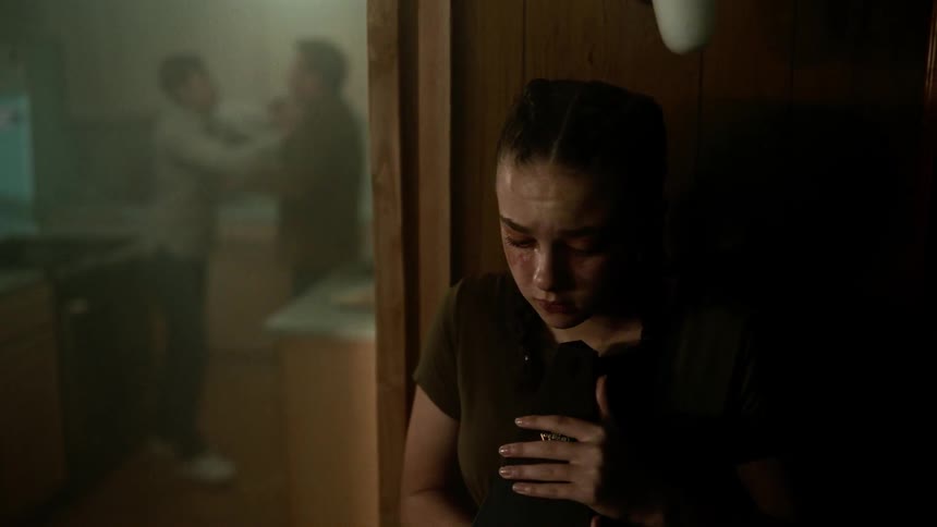 Young sad girl holding a metronome cry while watching her parents fight