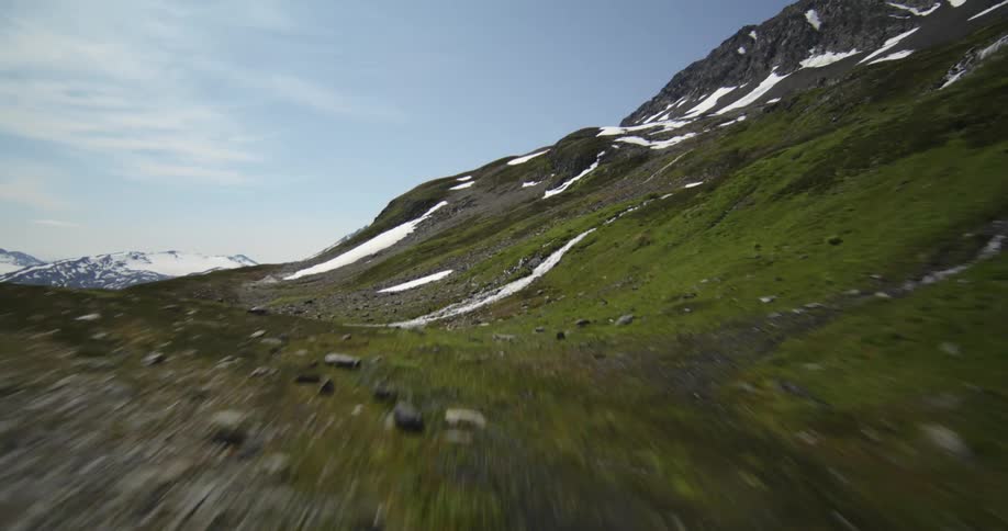 Landscape of water rocks and hills at midday