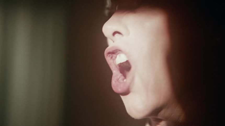 A woman screaming with great anger