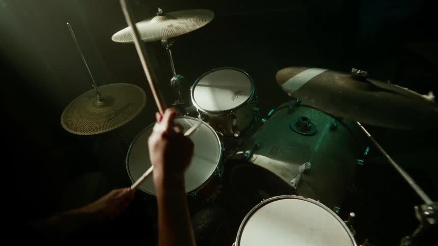 A man is playing the drums