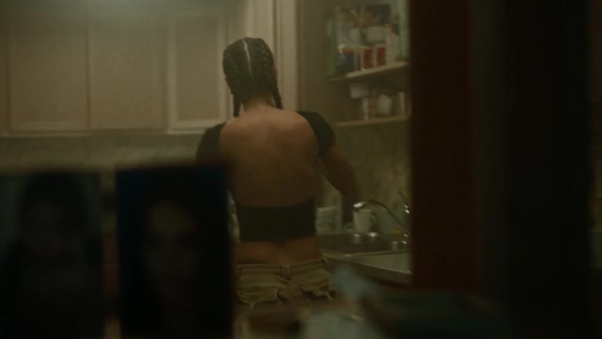 A woman is smashing stuff in her kitchen