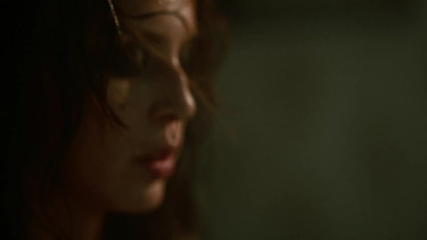 A woman breathing deeply as she calms down