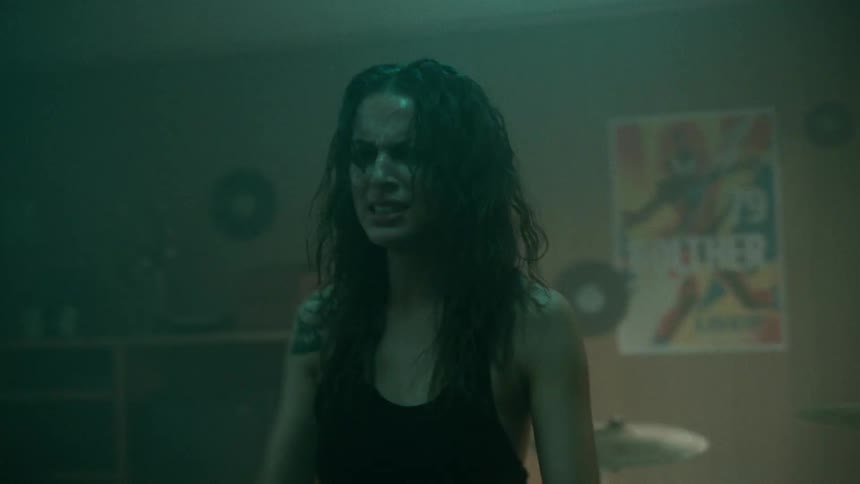 A woman with her hands on her head feeling upset and crying