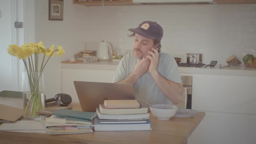 A man is talking on his cell phone