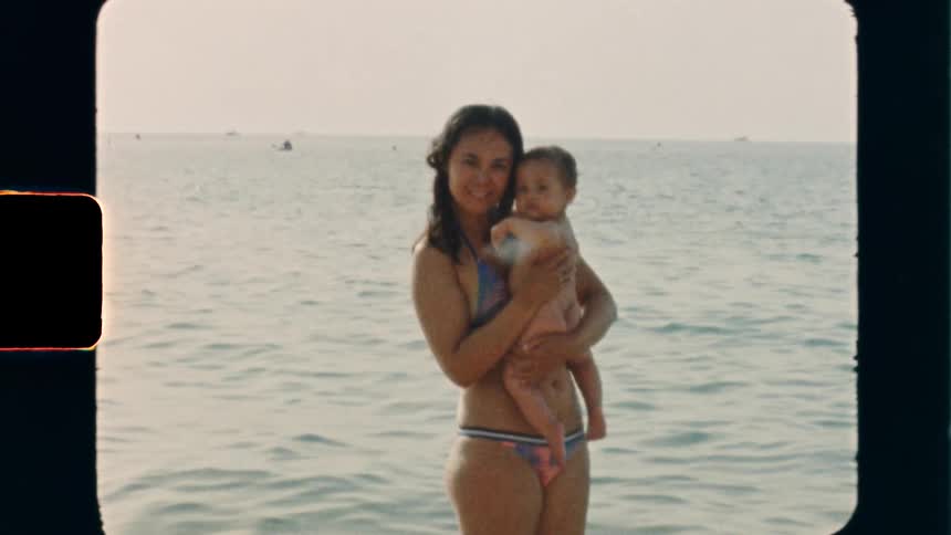 Super 8 film of a mother and child at the beach on a summer day