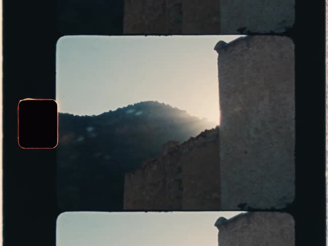Super 8 film of the sun flare around the corner of a building