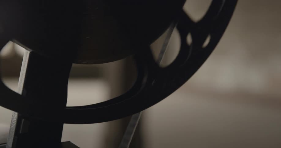 A projector is turning film