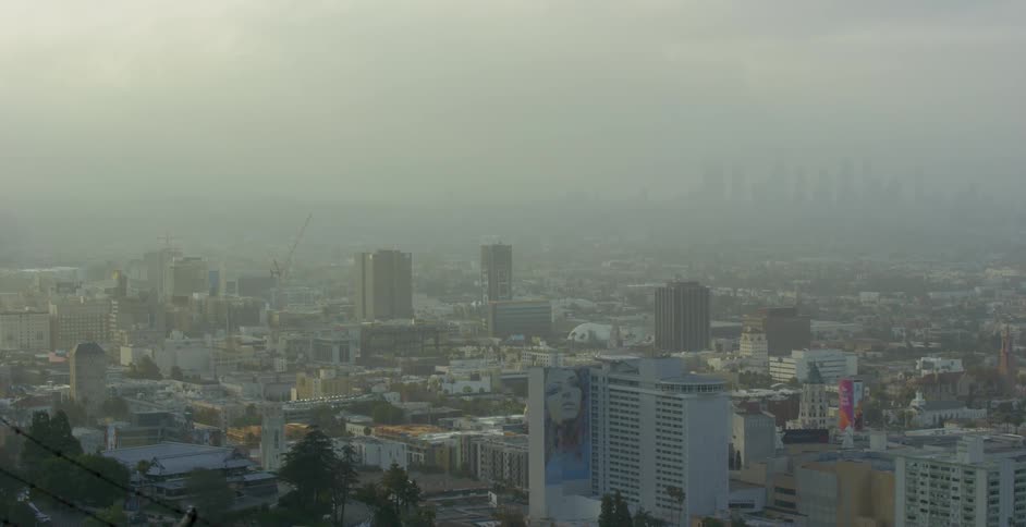 The city ahead has heavy fog around it