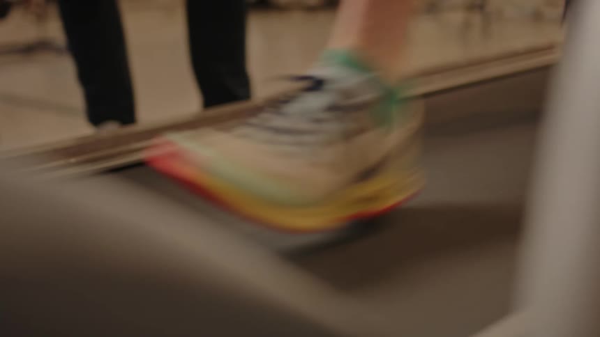 A person putting on vans and running on the treadmill