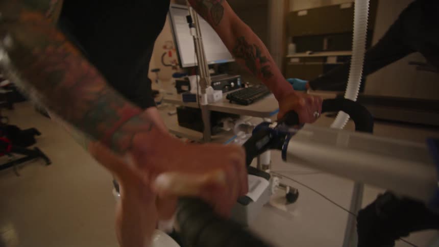 A man working out on a cycling machine