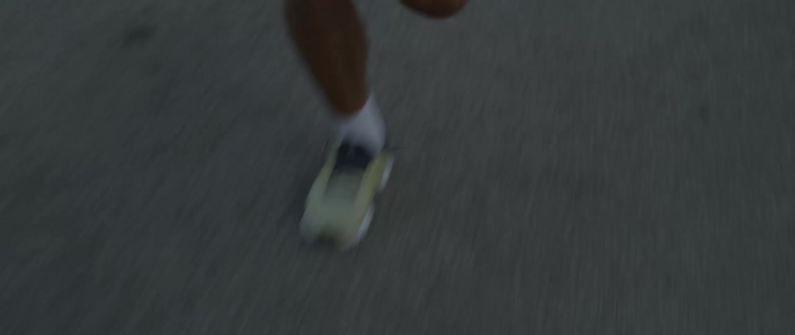 A man running on a road during the day