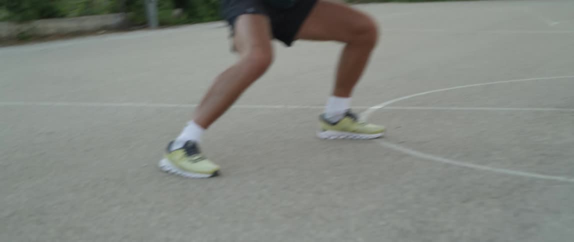A man is running all around the court