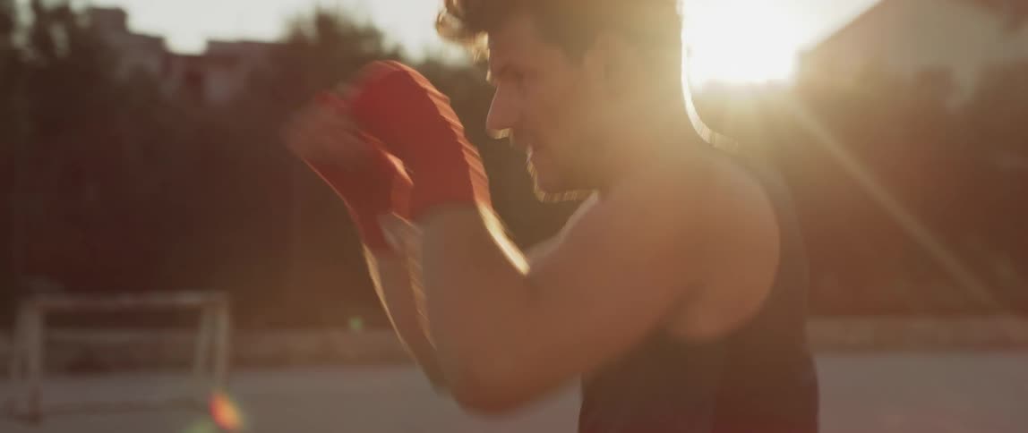 A man practicing fighting during the sunny morning