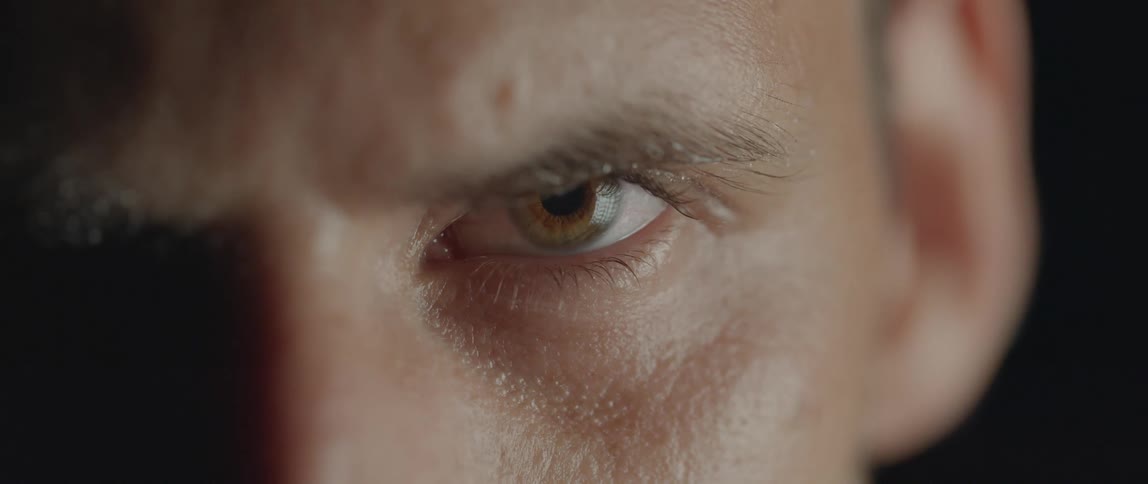 Close up of an opened left eye of a man