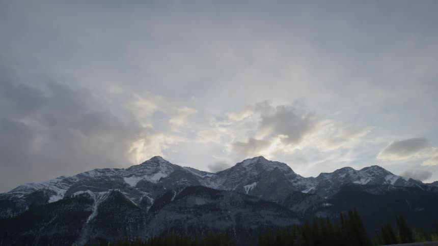 The mountain range ahead has some snow on top