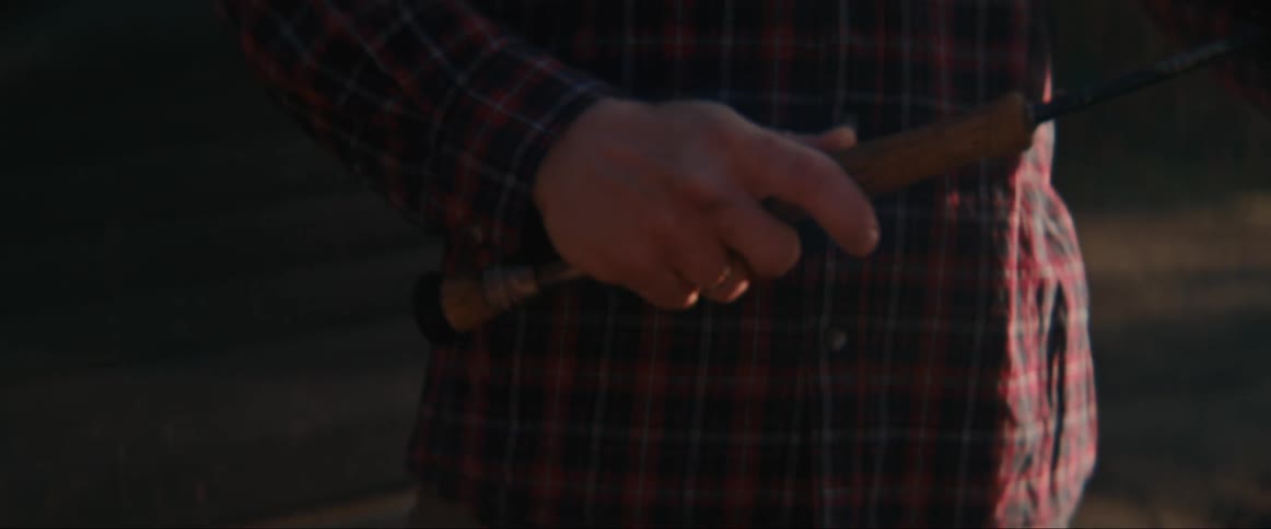 A persons hand picking up an instrument