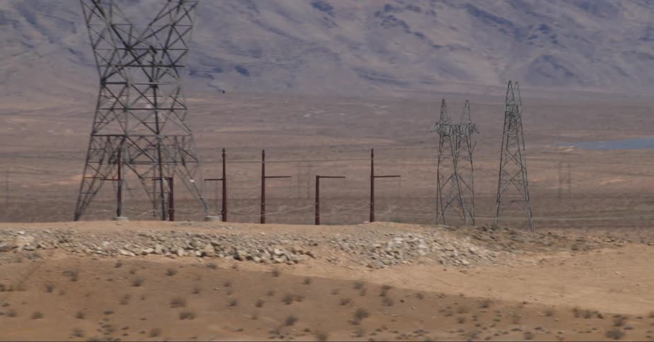 Electric towers in a wild desert landscape