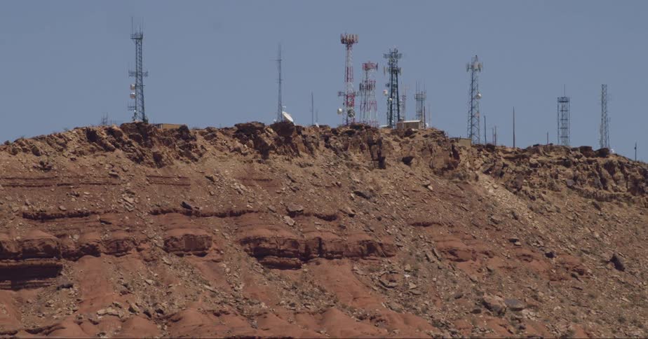 Mast antennas atop a mountain in the desert