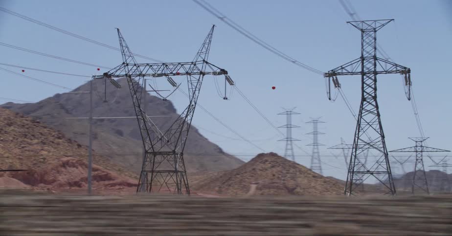 Large utility towers cover the hills
