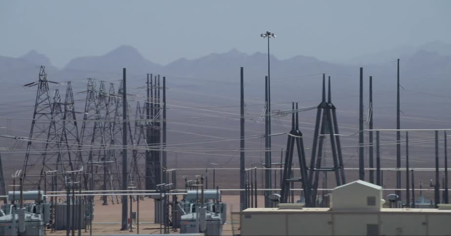 Roadside power plant mountains behind