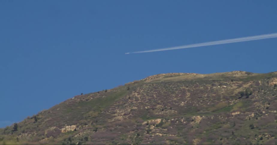 Jet leaving trails on the sky at midday