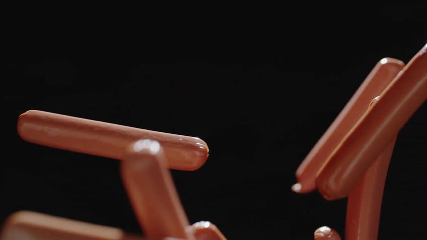 The hot dogs fly past