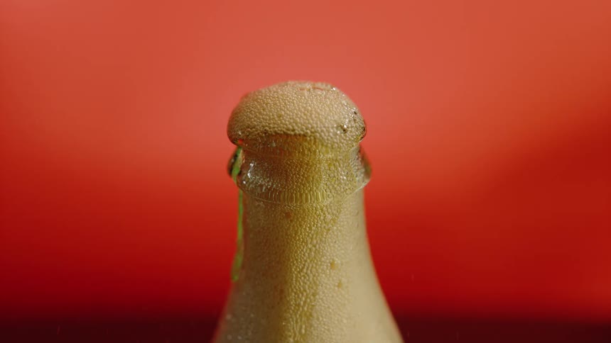 Gas bubbles leaking out of a soda bottle