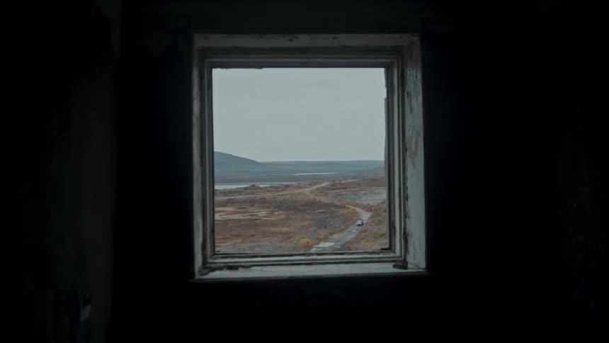 View from a window of the sea on a cloudy day