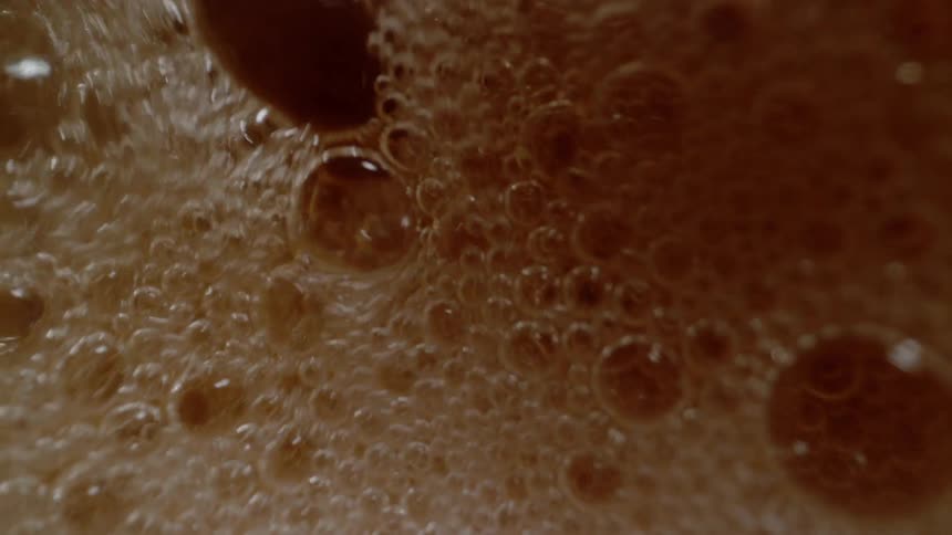 Small bubbles in the yellow liquid