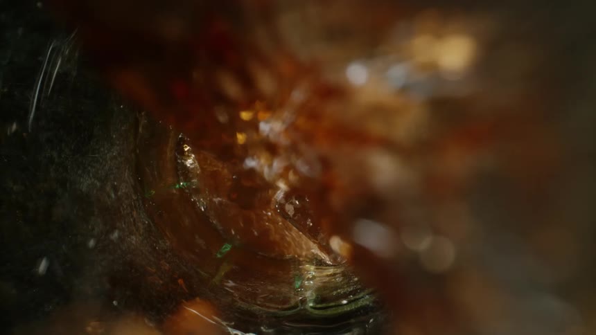Filling a soda glass with ice cubes inside