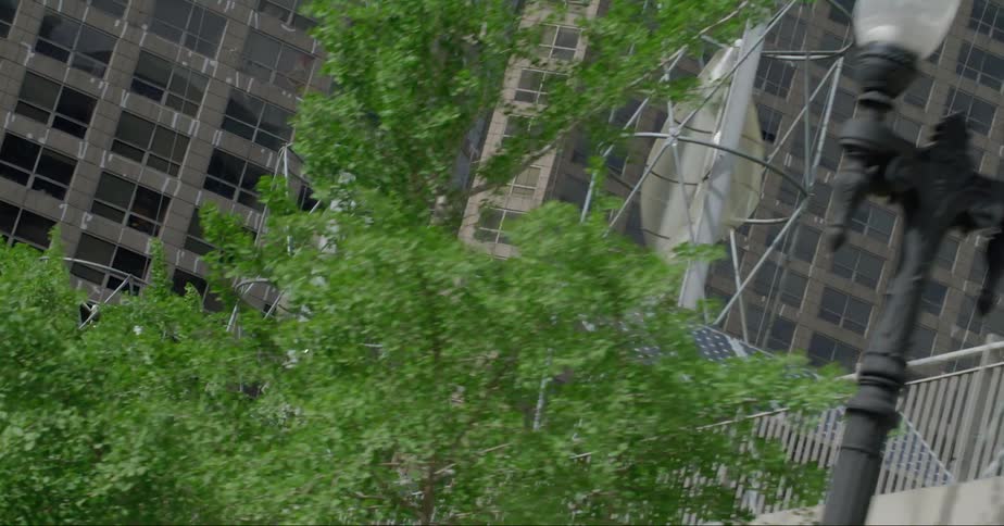 Windcatchers connected to solar panels in a downtown area