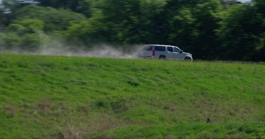 Suv drives through rural area