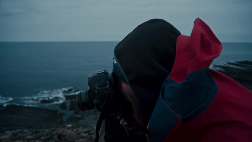 A man photographing the landscape during the winter