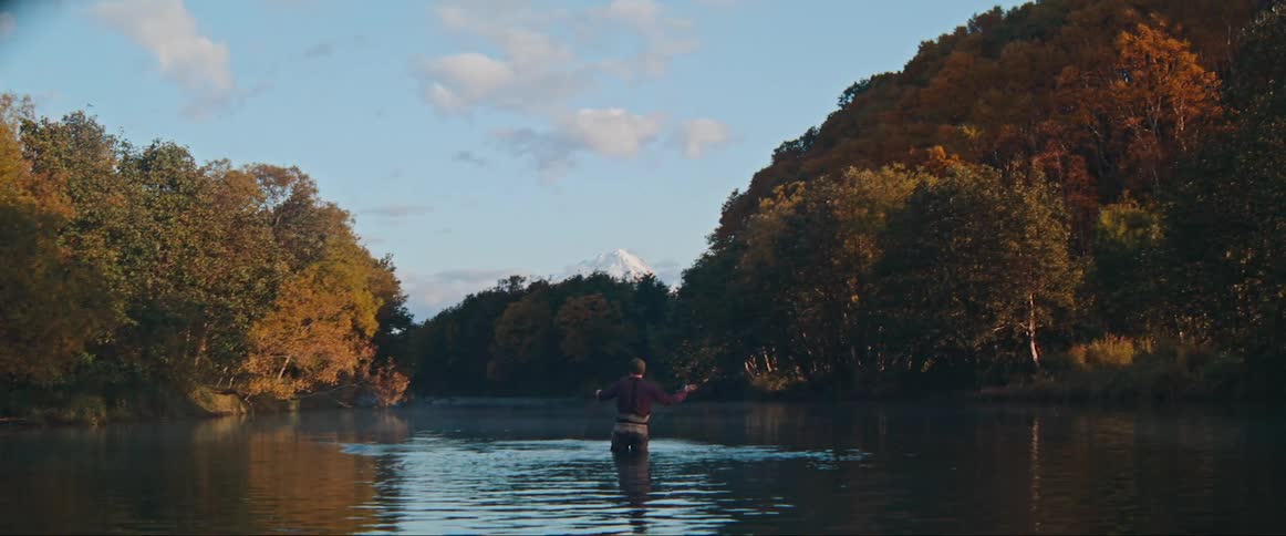 A man fishing in a river