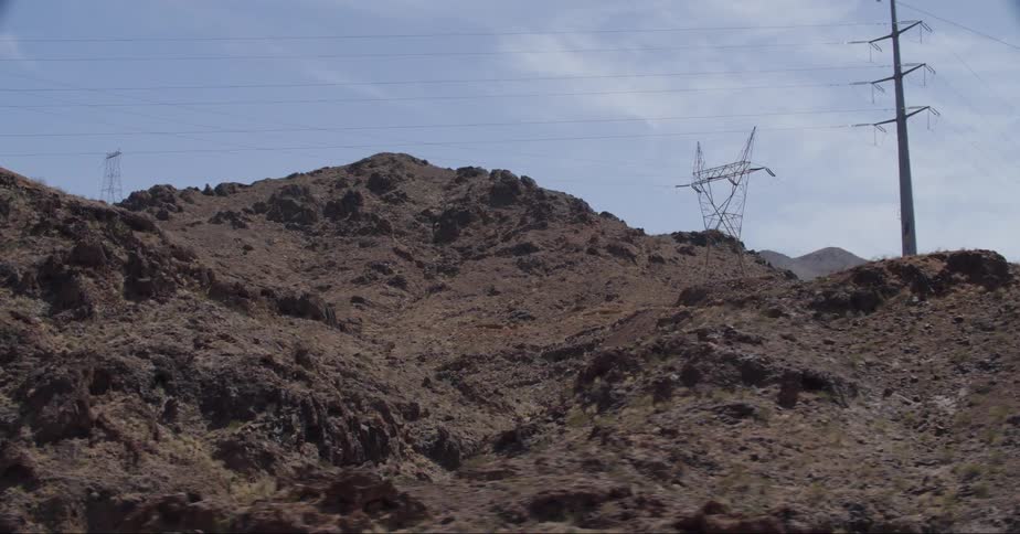 Mountains and cliffs with electricity transmission towers