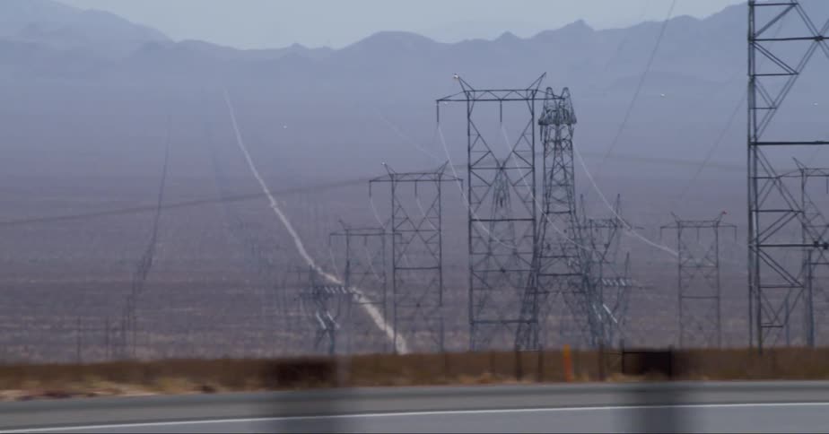Vehicles pass the field of power lines
