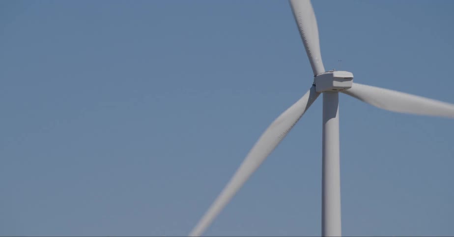 The propeller of a wind farm rotates during the day